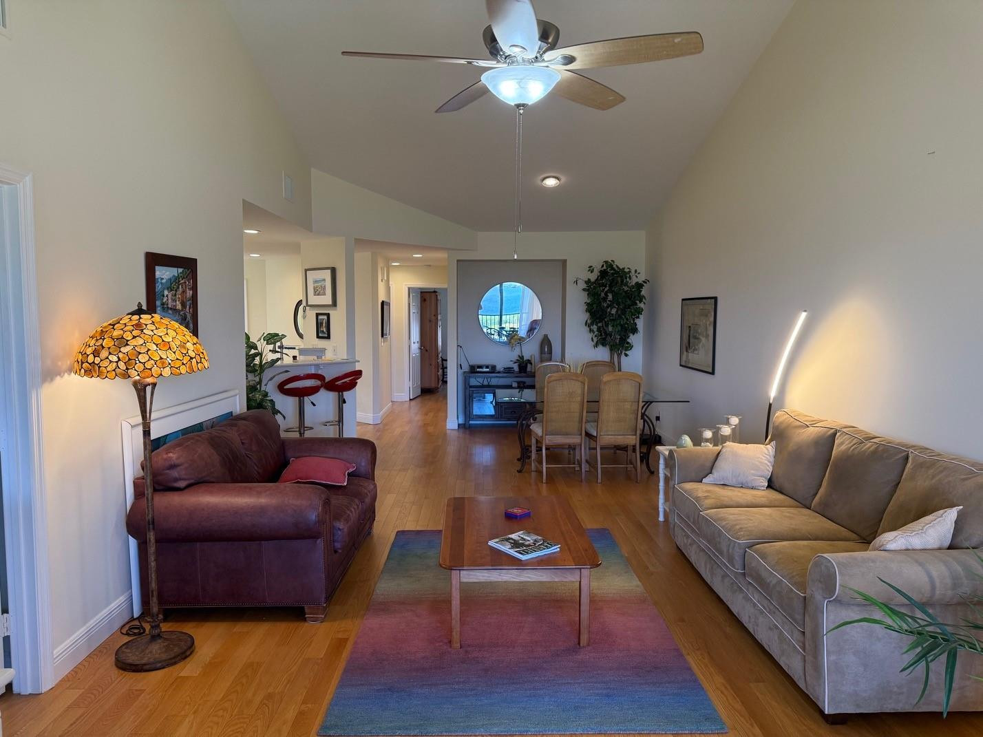 6102 Southeast Landing Way, Unit 13 Stuart, FL 34997 - Photo 7 of 14 a living room with furniture and wooden floor
