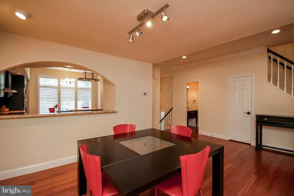 11560 Hemingway Drive Reston, VA 20194 - Photo 8 of 29 a view of a dining room with furniture and wooden floor