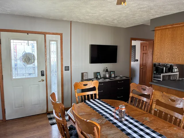 a view of a dining room with furniture window and outside view