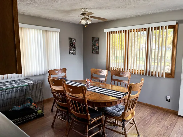 a kitchen with stainless steel appliances granite countertop a refrigerator a stove and a sink