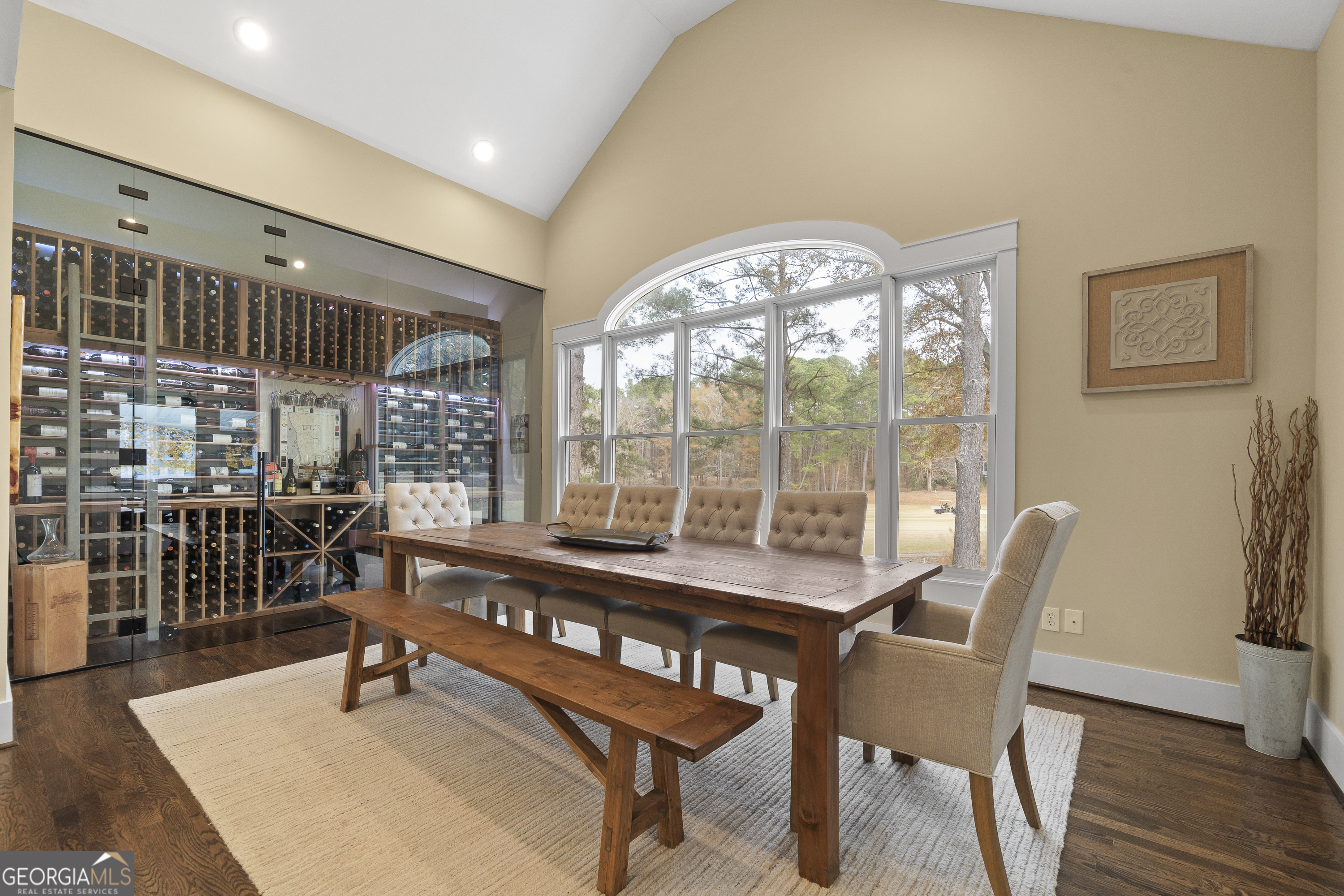 100 Camelrest Lane Eatonton, GA 31024 - Photo 15 of 59 a dining room with furniture a chandelier and wooden floor