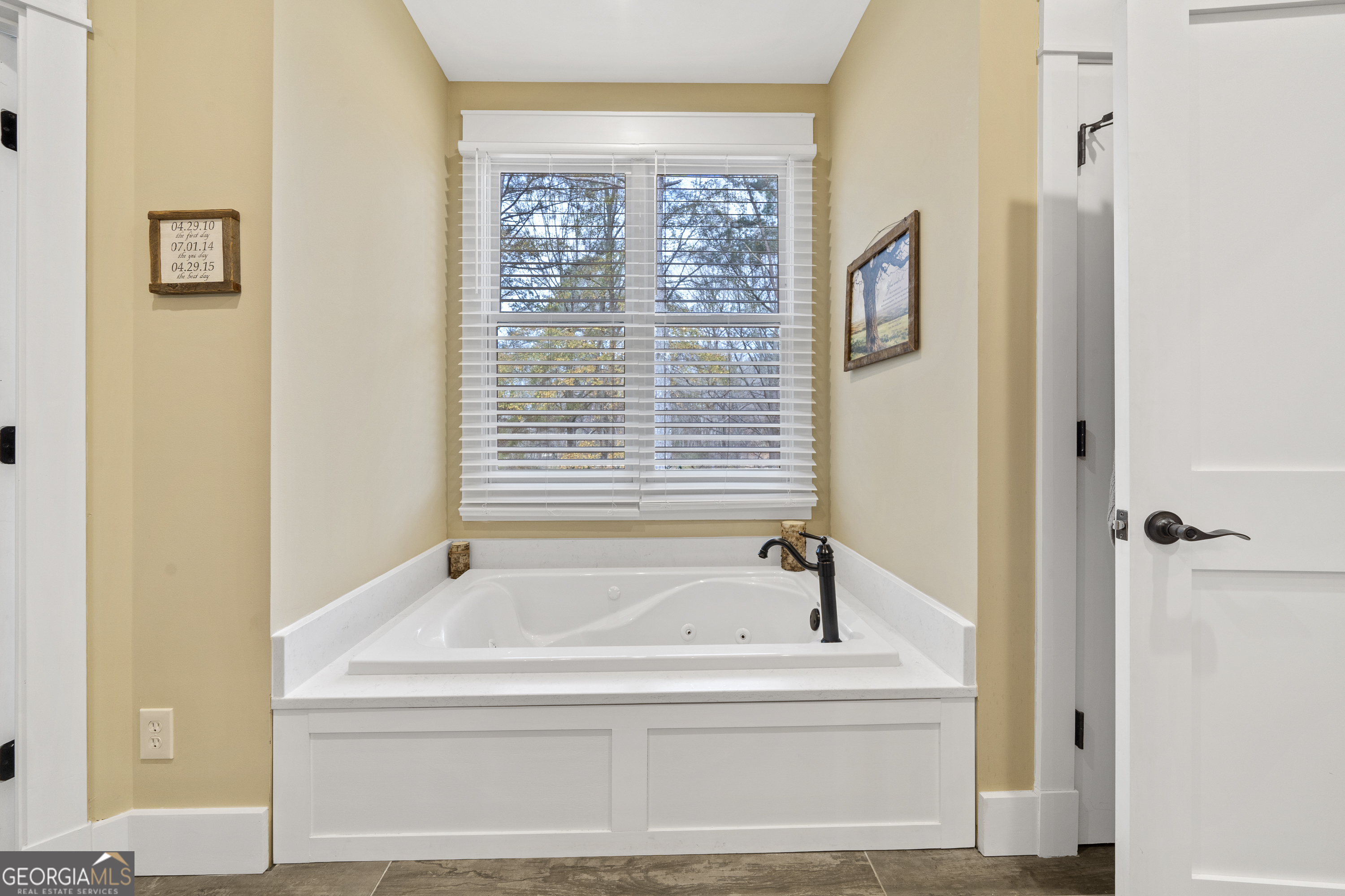 100 Camelrest Lane Eatonton, GA 31024 - Photo 24 of 59 a bathroom with bathtub and window