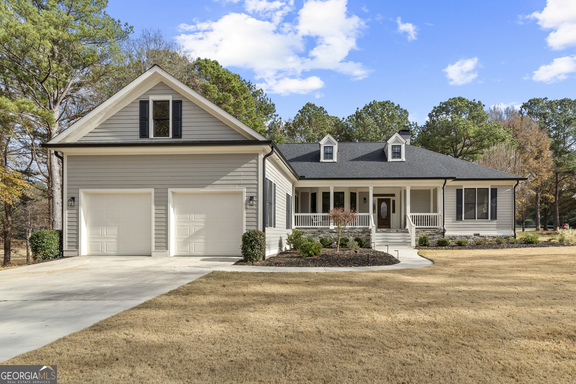 100 Camelrest Lane Eatonton, GA 31024 - Photo 3 of 59 a front view of a house with a yard