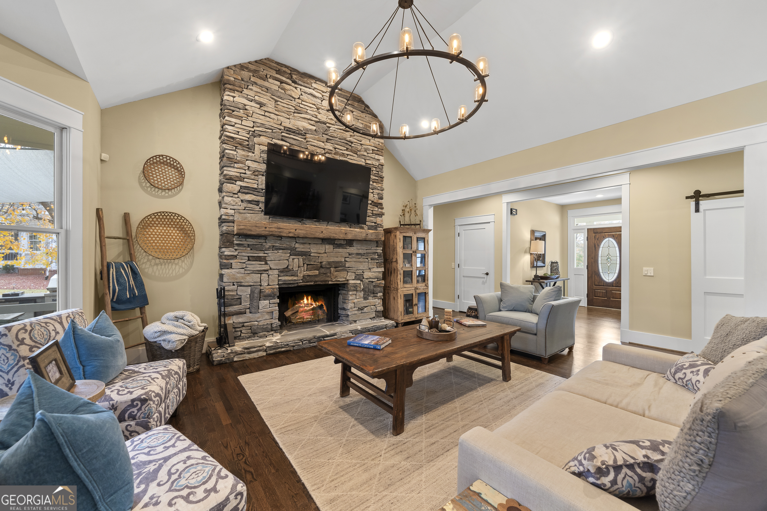 100 Camelrest Lane Eatonton, GA 31024 - Photo 38 of 59 a living room with furniture a fireplace and a large mirror