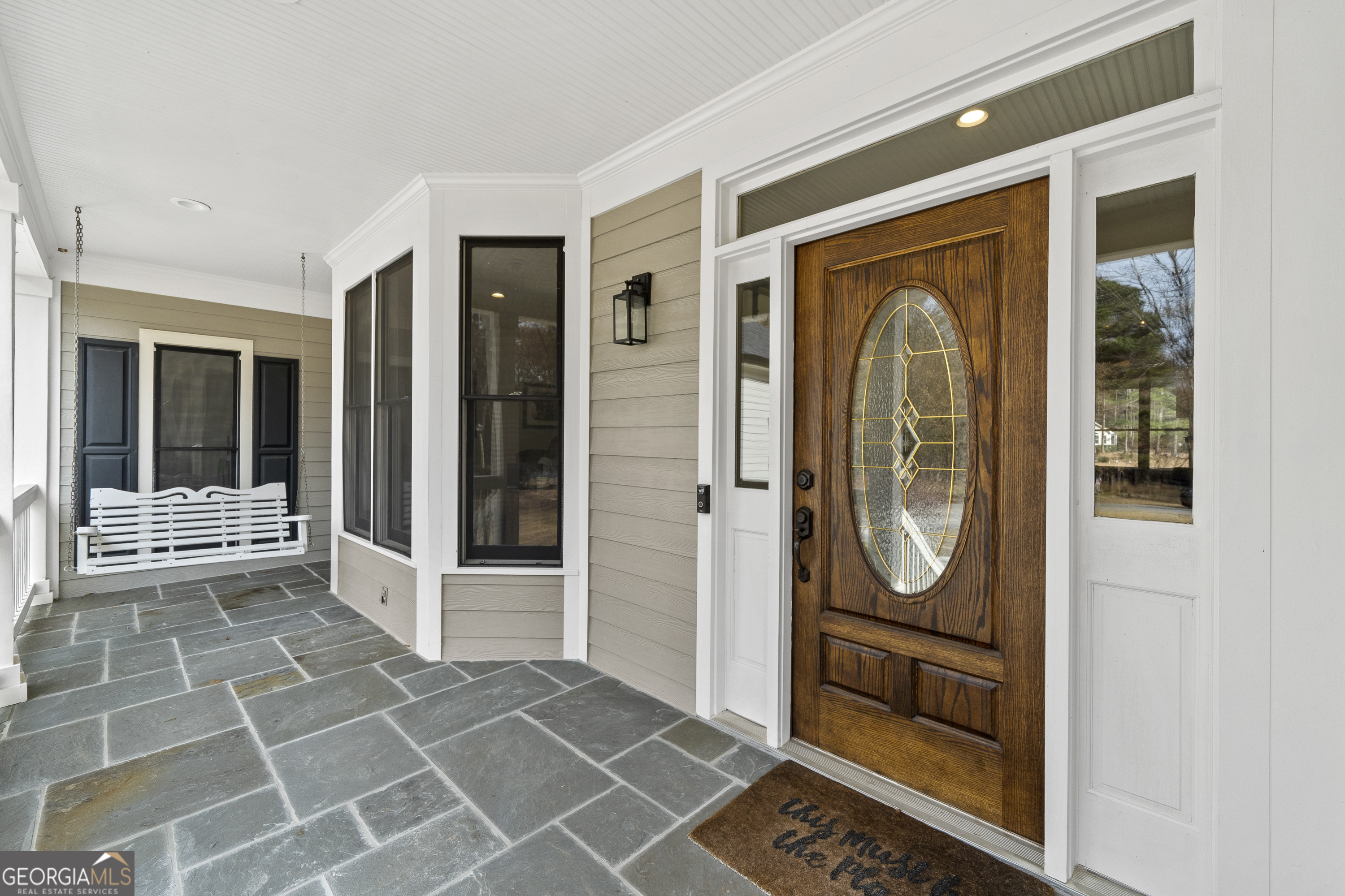 100 Camelrest Lane Eatonton, GA 31024 - Photo 4 of 59 a view of a entryway door front of a house