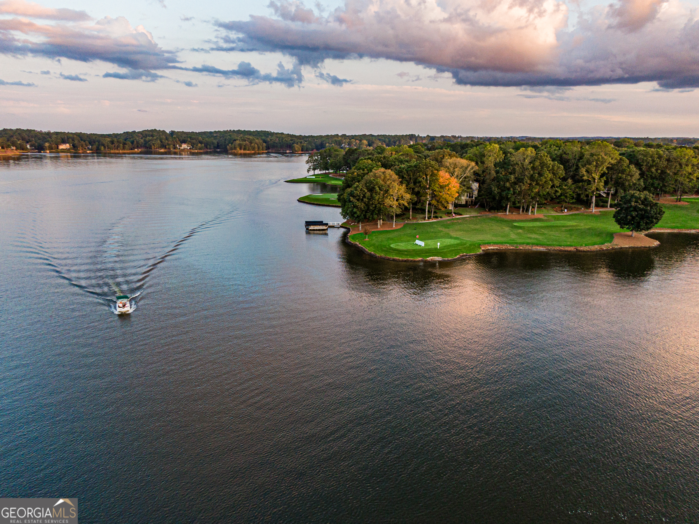 100 Camelrest Lane Eatonton, GA 31024 - Photo 57 of 59 a view of a lake with houses in back