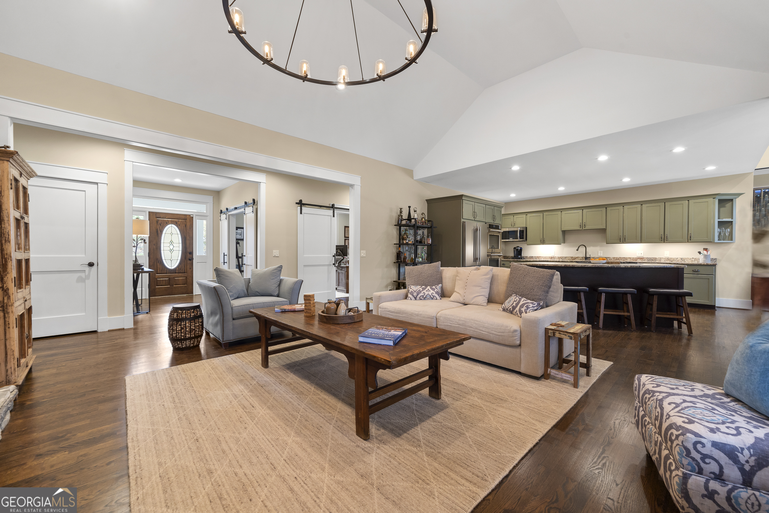 100 Camelrest Lane Eatonton, GA 31024 - Photo 9 of 59 a living room with furniture a table and kitchen view