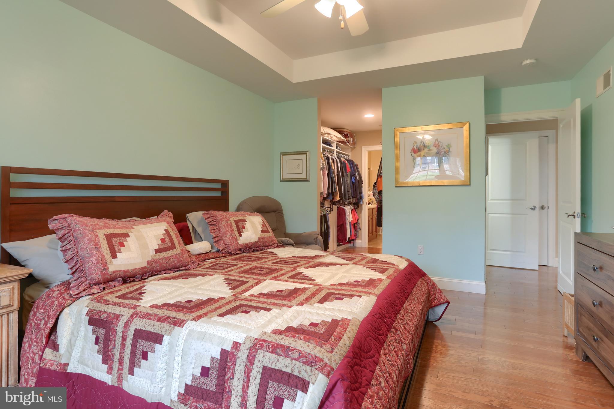 162 High Pointe Drive Hummelstown, PA 17036 - Photo 18 of 38 a bedroom with a bed and a chandelier