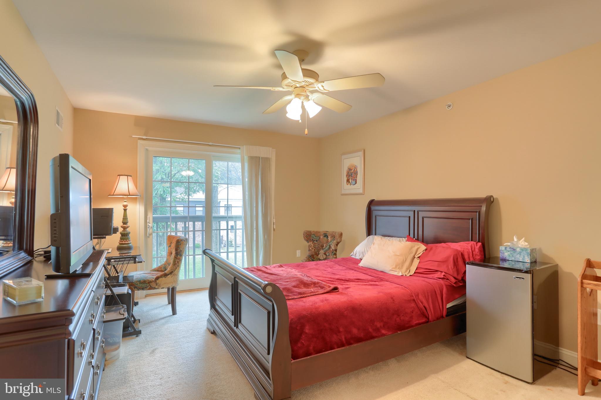 162 High Pointe Drive Hummelstown, PA 17036 - Photo 26 of 38 a bedroom with a bed and a chandelier