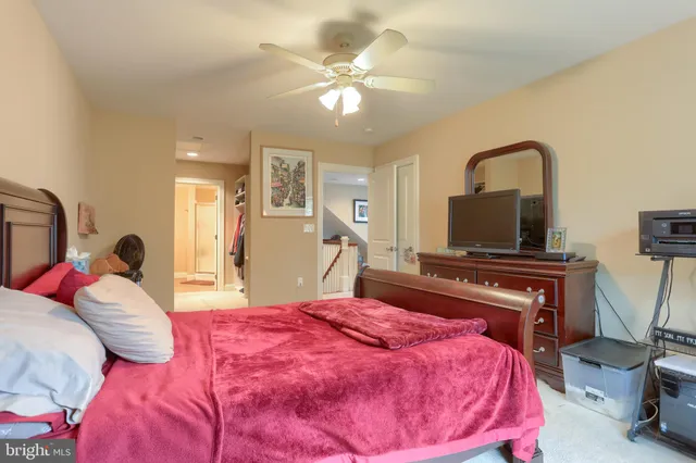 a bed room with a bed and a television