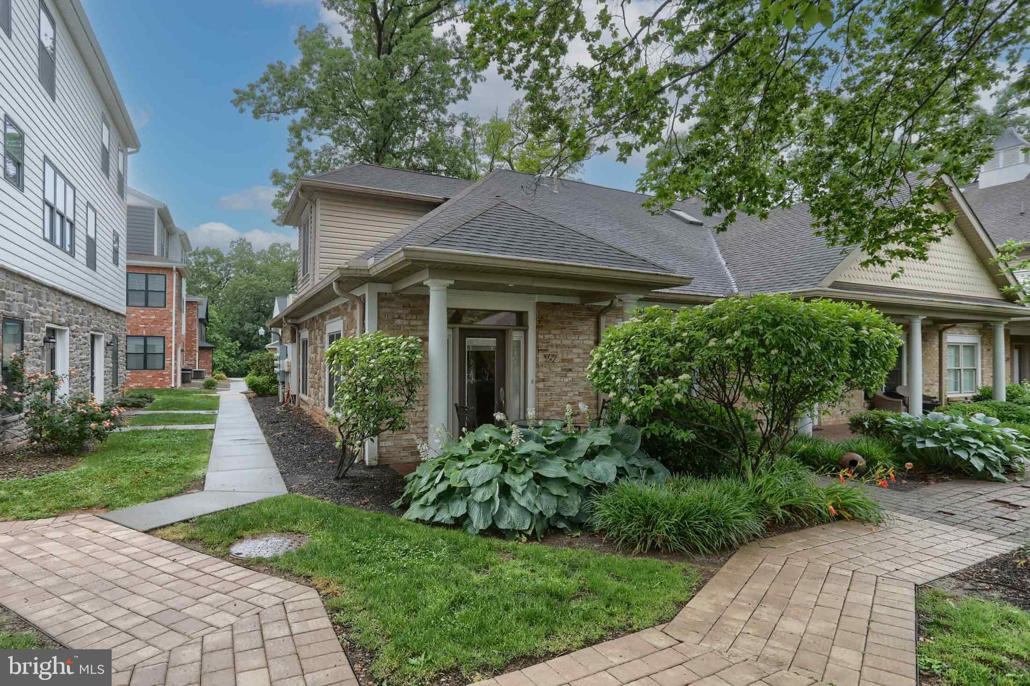 162 High Pointe Drive Hummelstown, PA 17036 - Photo 30 of 38 a front view of a house with a yard and potted plants