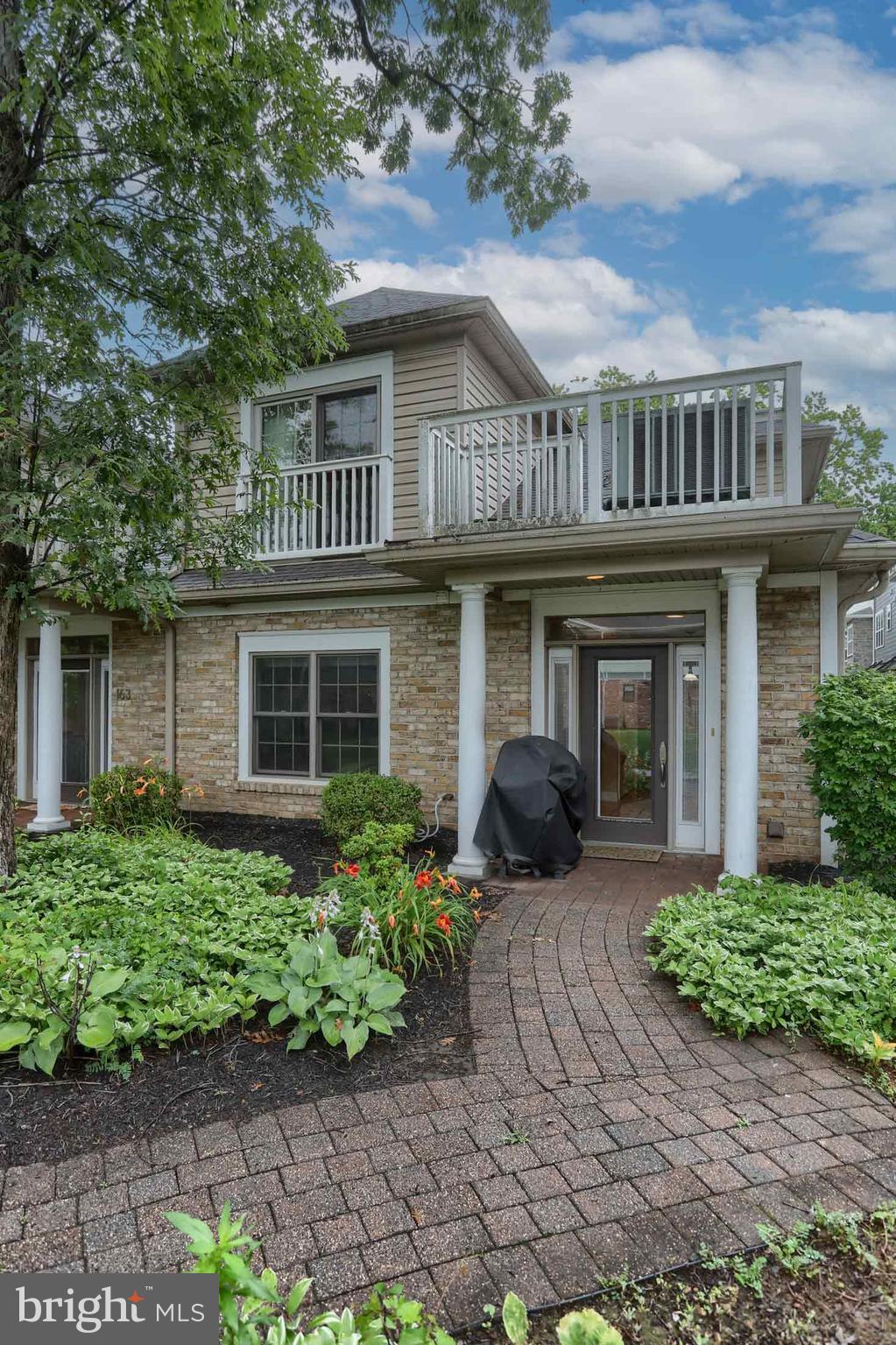 162 High Pointe Drive Hummelstown, PA 17036 - Photo 5 of 38 a front view of a house with a garden