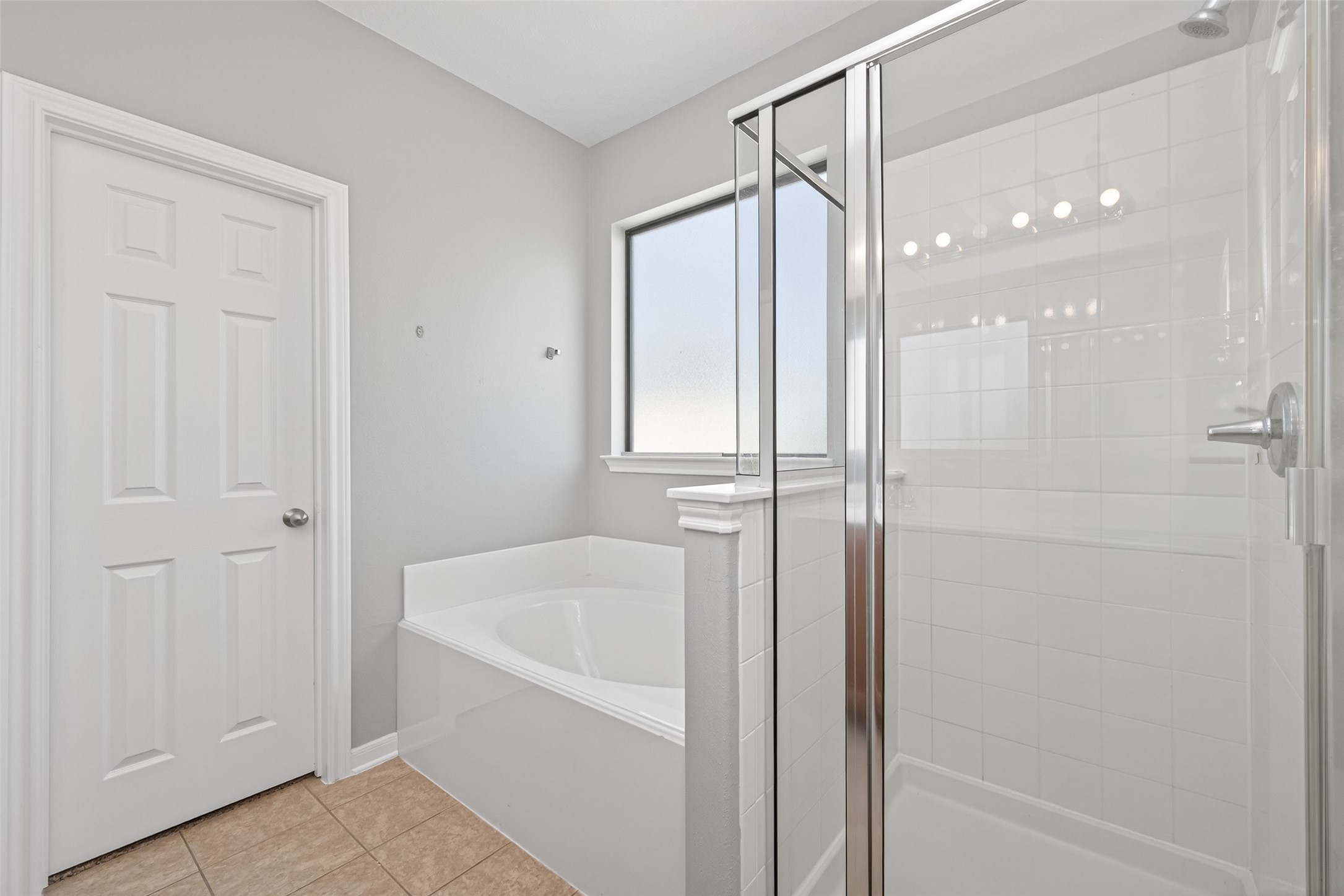 3646 Standing Rock Drive Spring, TX 77386 - Photo 11 of 30 a bathroom with a bathtub and a shower