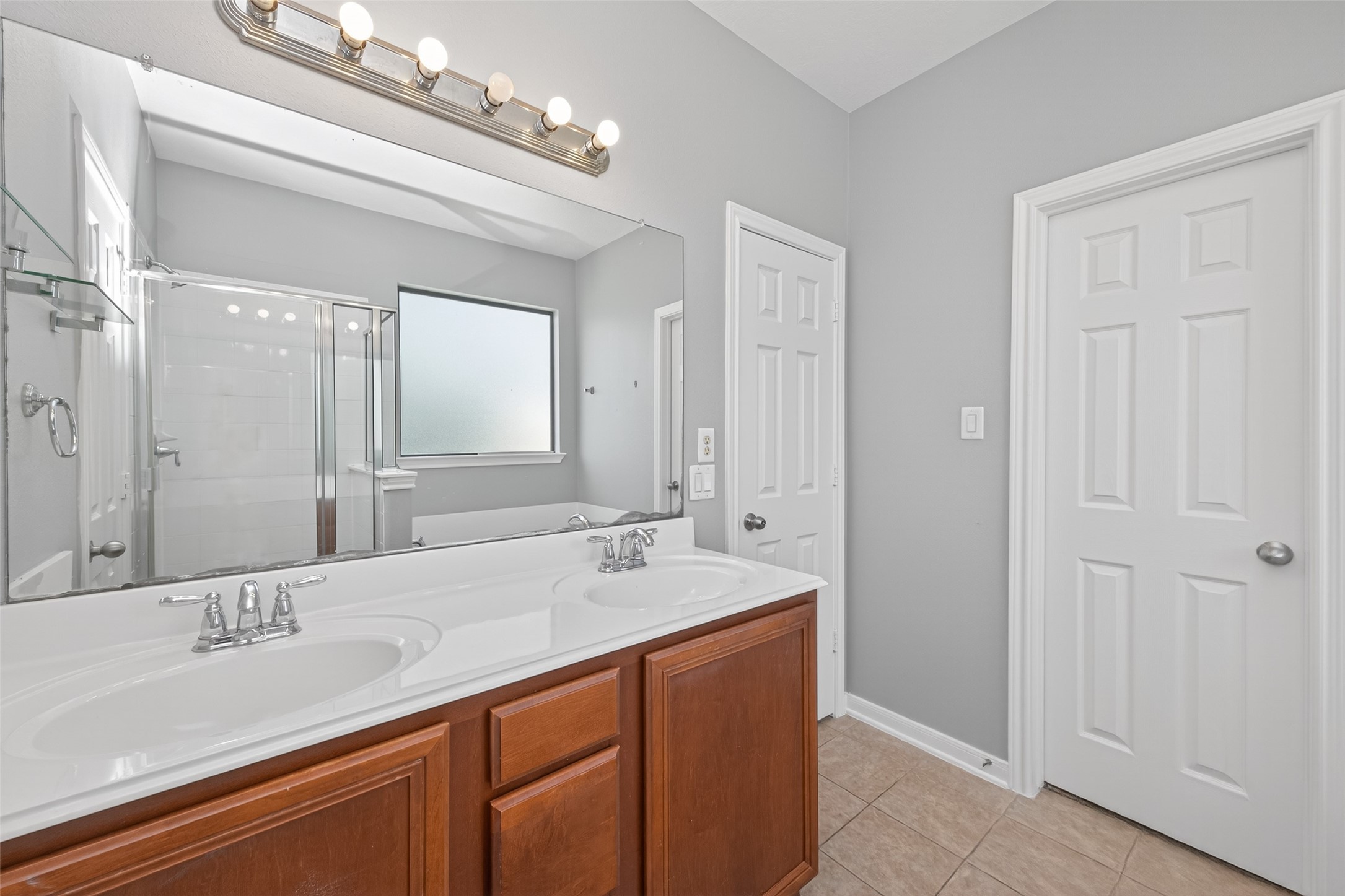 3646 Standing Rock Drive Spring, TX 77386 - Photo 13 of 30 a bathroom with a sink double vanity and a mirror