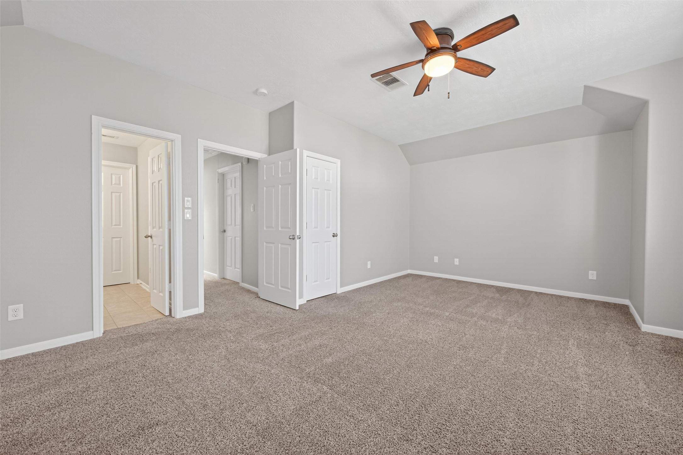 3646 Standing Rock Drive Spring, TX 77386 - Photo 17 of 30 a view of a room with a ceiling fan and a chandelier fan