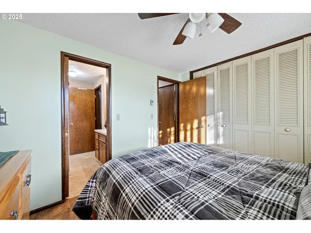 a bedroom with a bed and a walk in closet