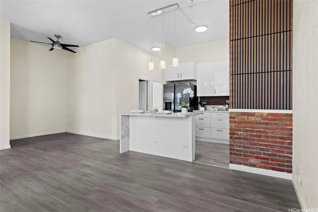 a view of kitchen with cabinets and wooden floor