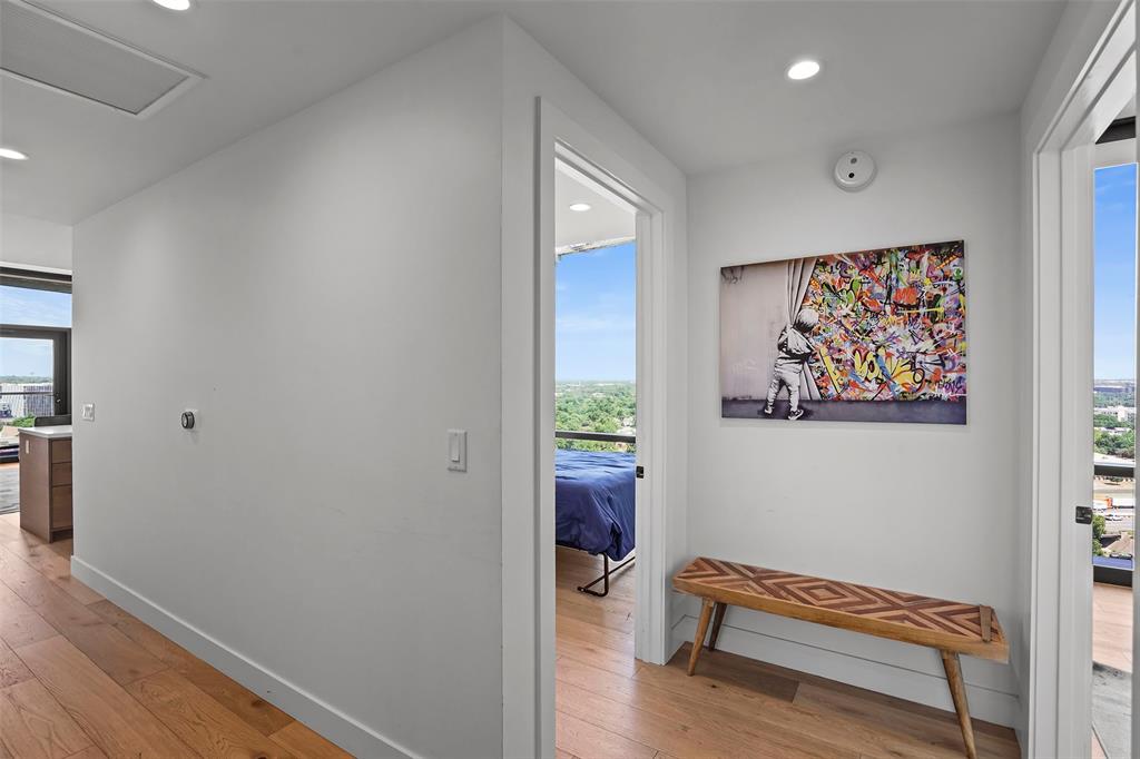 70 Rainey Street, Unit 1409 Austin, TX 78701 - Photo 17 of 38 Hall with light wood finished floors and recessed lighting