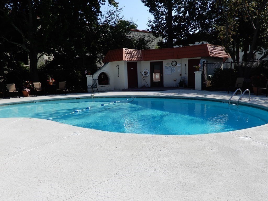 120 Fellsview Road, Unit 124 Stoneham, MA 02180 - Photo 20 of 20 front view of a house with a yard