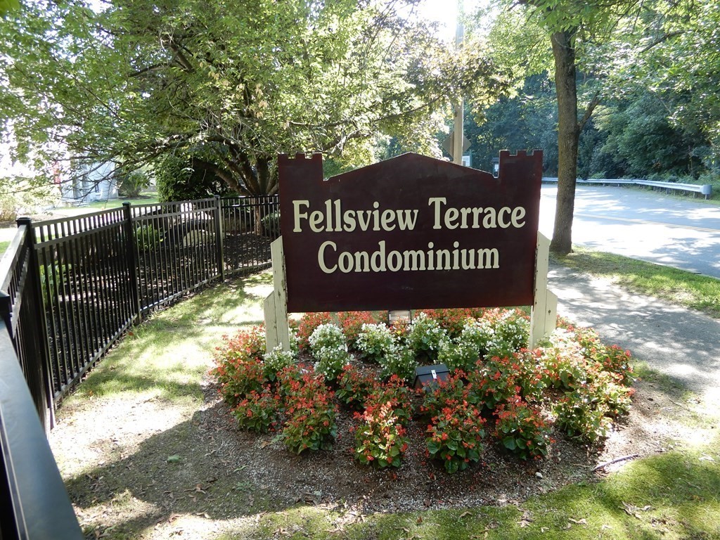 120 Fellsview Road, Unit 124 Stoneham, MA 02180 - Photo 2 of 20 a sign on the side of the road