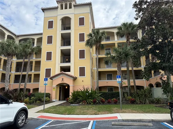 a front view of a residential apartment building with a yard