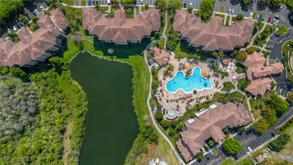 an aerial view of a house with a yard and garden