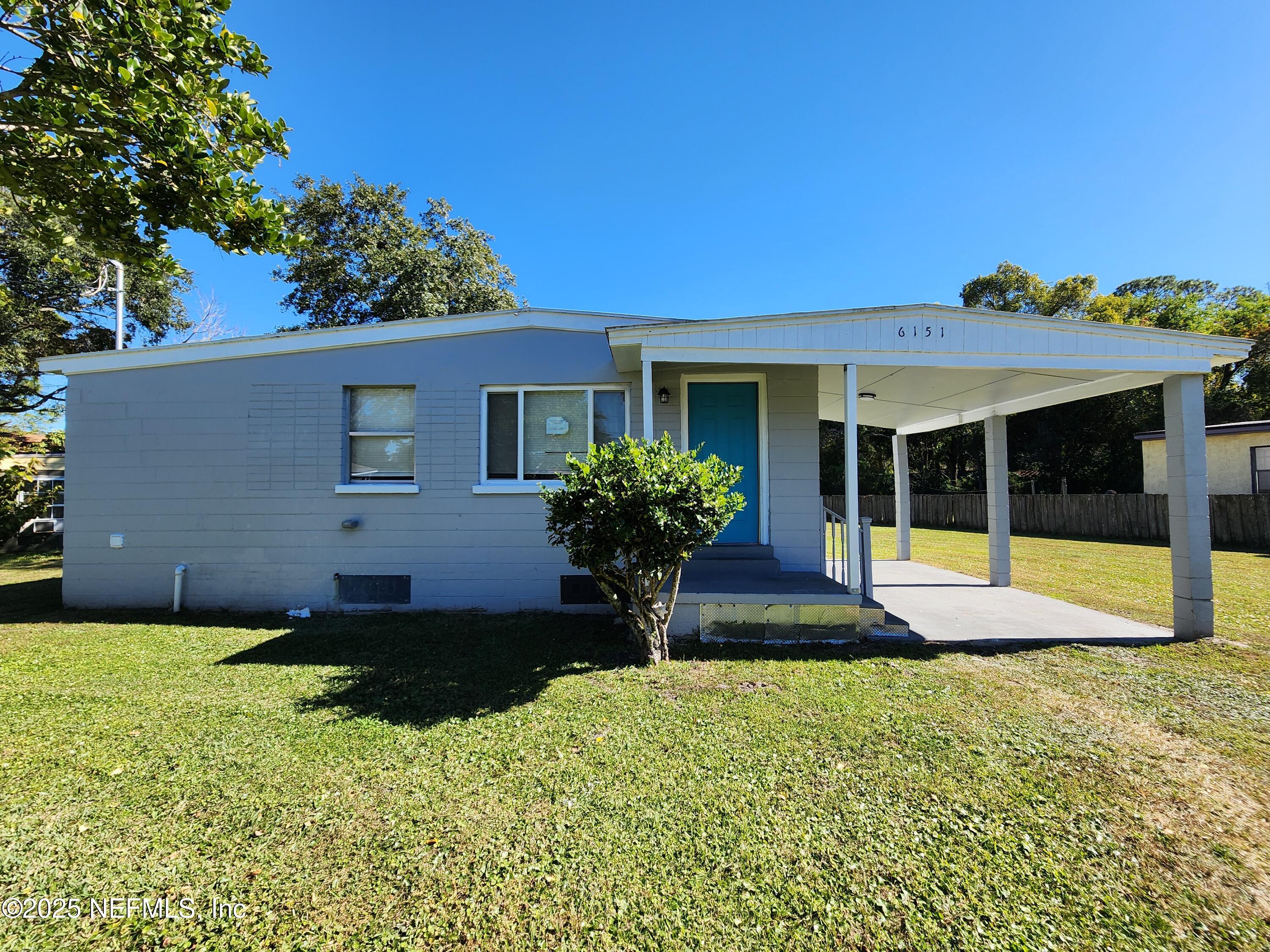 6151 Ardisia Road West Jacksonville, FL 32209 - Photo 1 of 18 a view of a house with pool and a garden