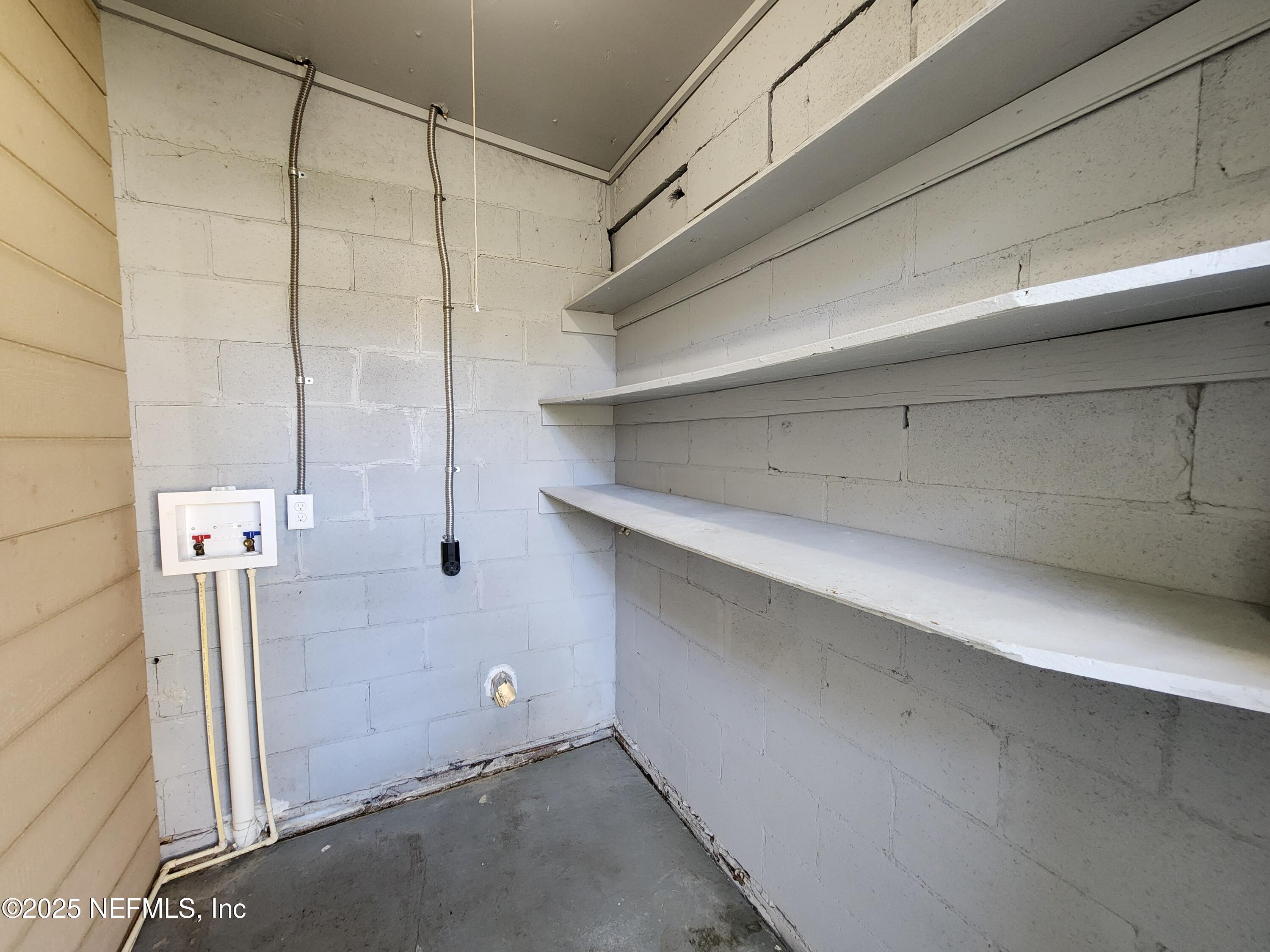 6151 Ardisia Road West Jacksonville, FL 32209 - Photo 15 of 18 a view of a room with racks on the wall