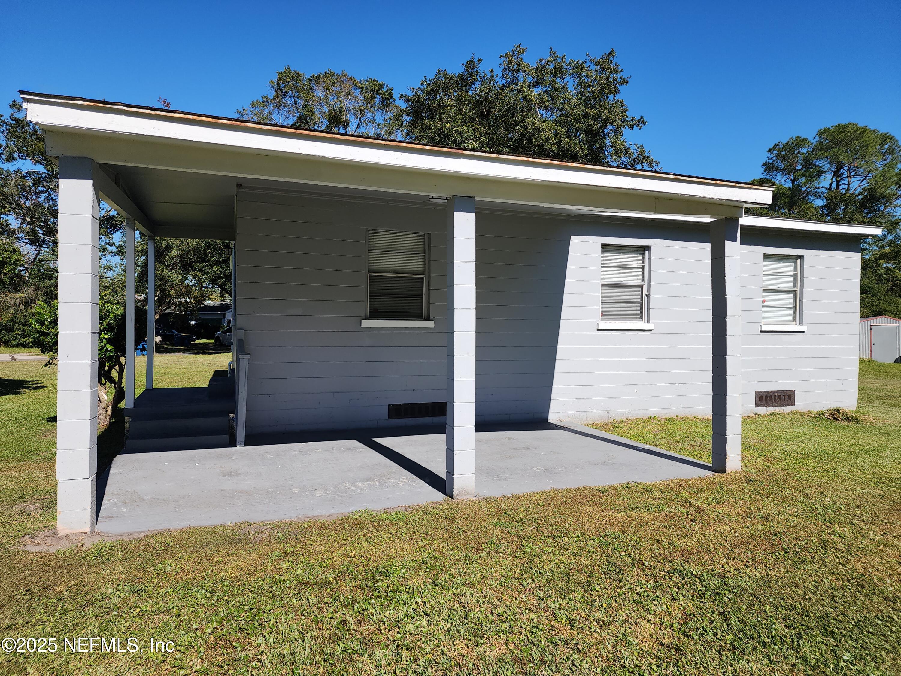 6151 Ardisia Road West Jacksonville, FL 32209 - Photo 17 of 18 a view of a house with potted plants