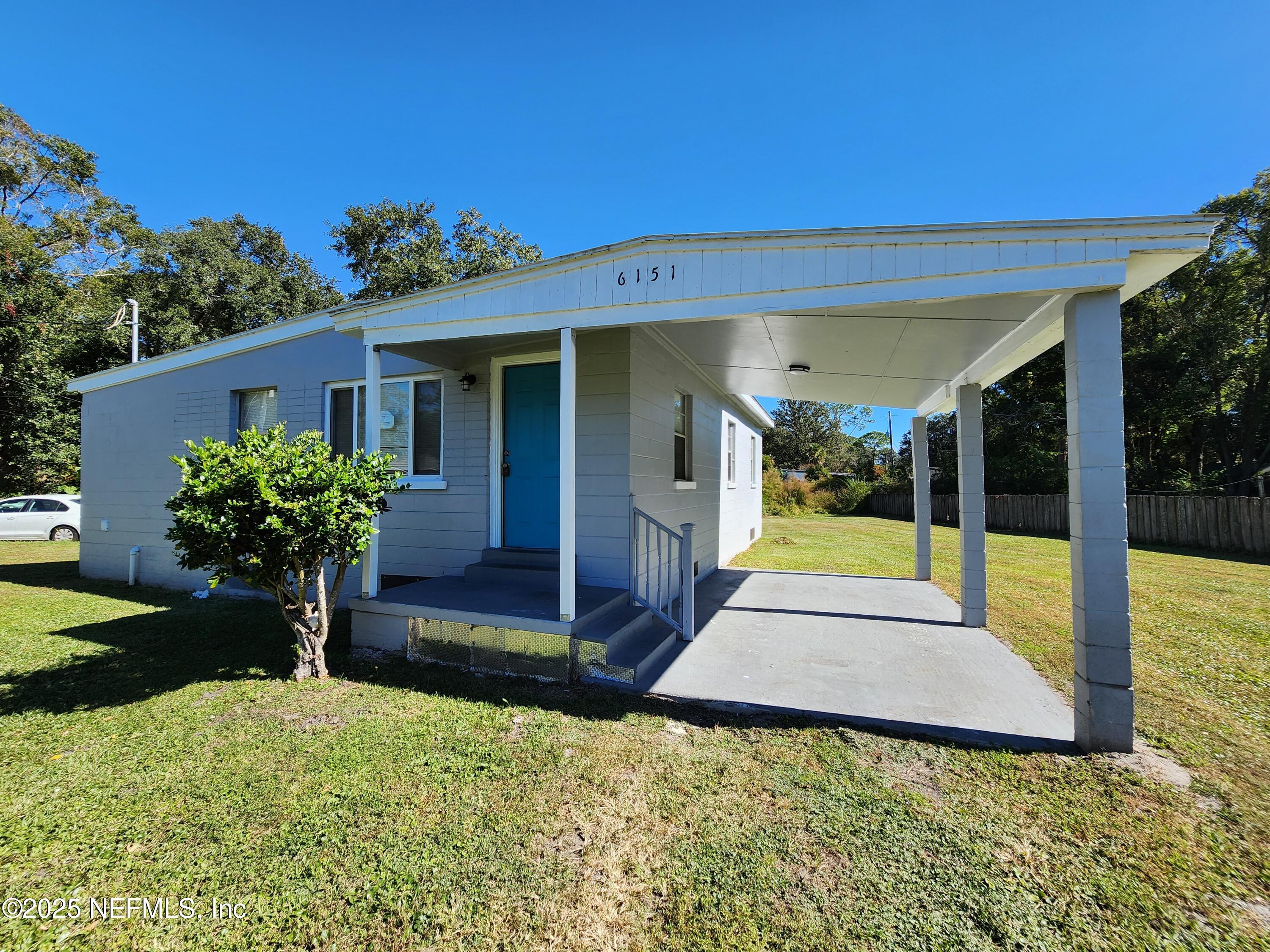6151 Ardisia Road West Jacksonville, FL 32209 - Photo 2 of 18 a view of a house with backyard porch and garden