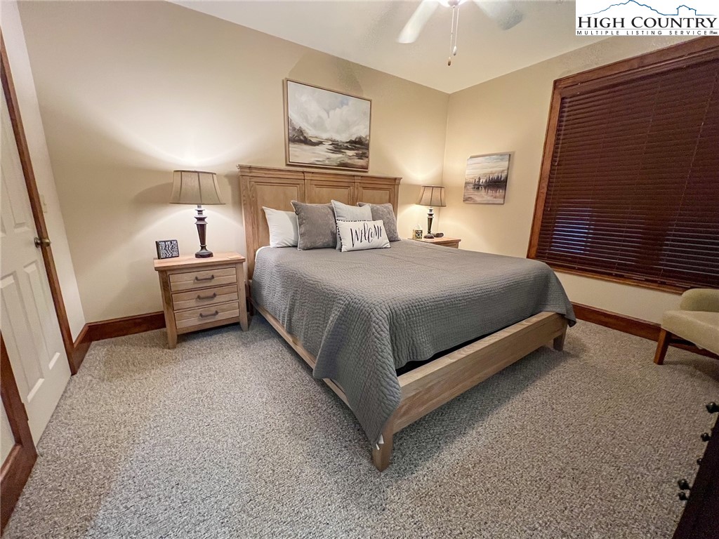 164 Evening View Lane, Unit CB2 Boone, NC 28607 - Photo 8 of 23 a bedroom with a bed and wooden floor