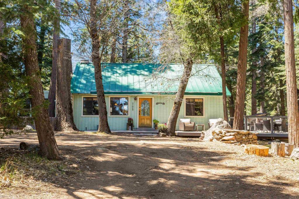 a view of a house with a snow on the road