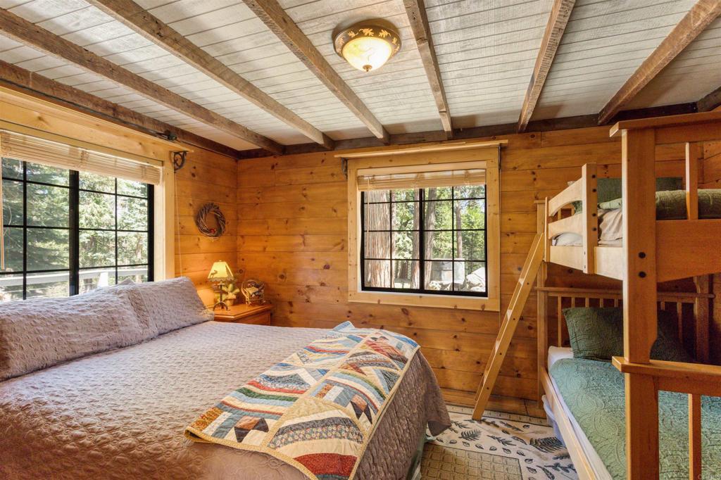 21868 Crestline Road Palomar Mountain, CA 92060 - Photo 15 of 26 a bedroom with a bed next to a window