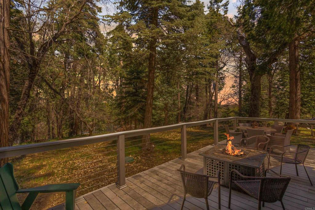 21868 Crestline Road Palomar Mountain, CA 92060 - Photo 20 of 26 a view of a balcony with two chairs and a table