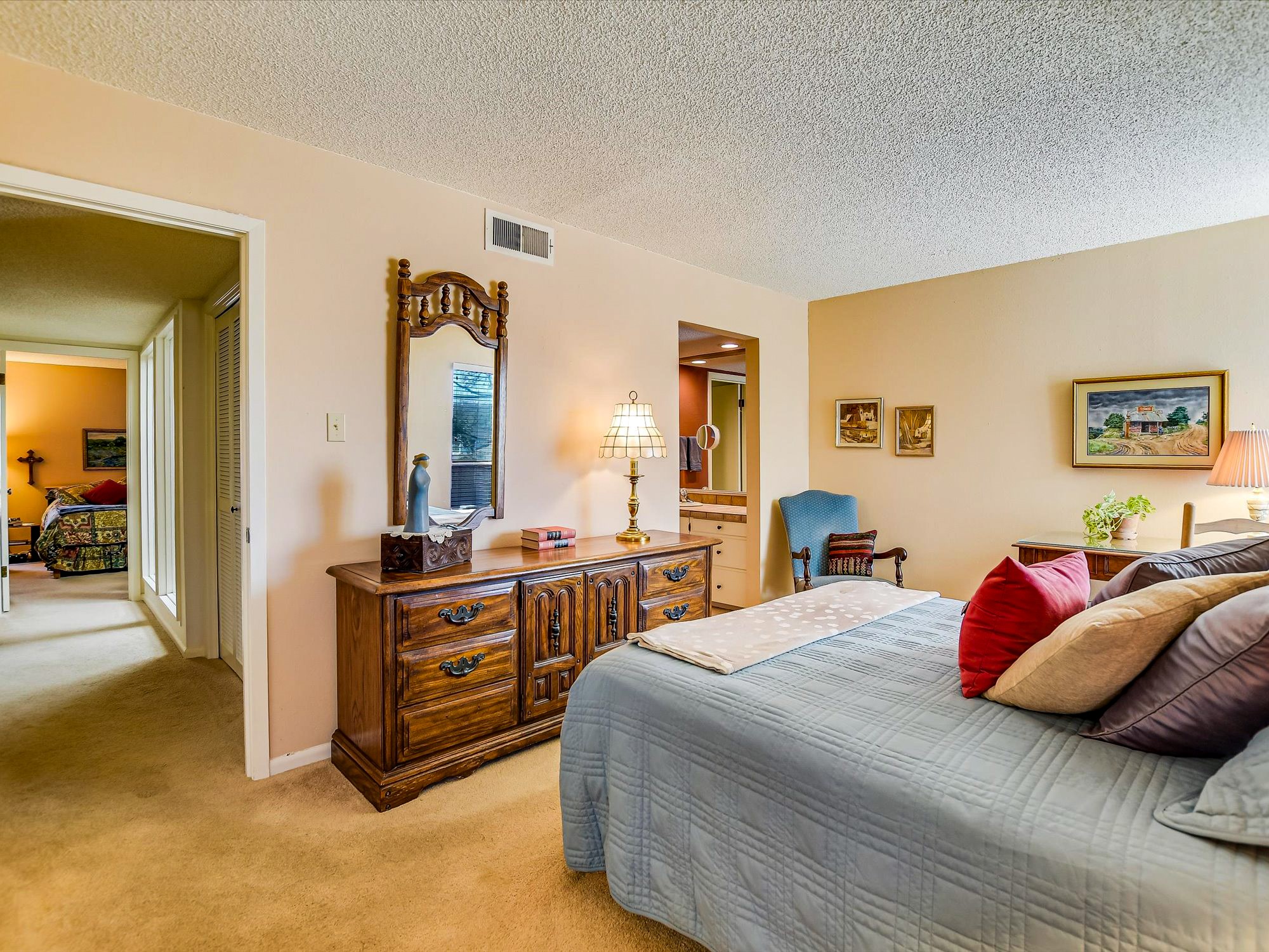 3500 Enfield Road, Unit E Austin, TX 78703 - Photo 13 of 20 a bedroom with a bed and a cabinets