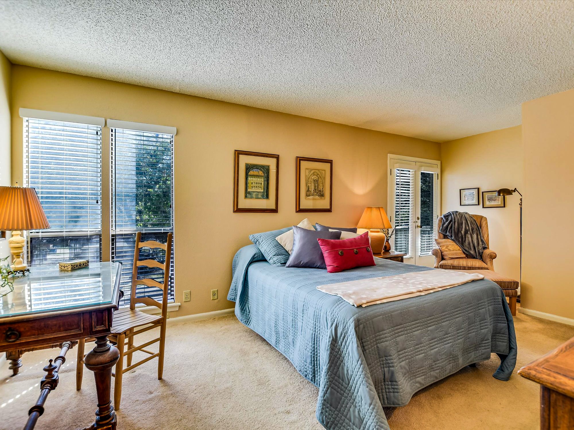 3500 Enfield Road, Unit E Austin, TX 78703 - Photo 15 of 20 a bedroom with a bed and a desk