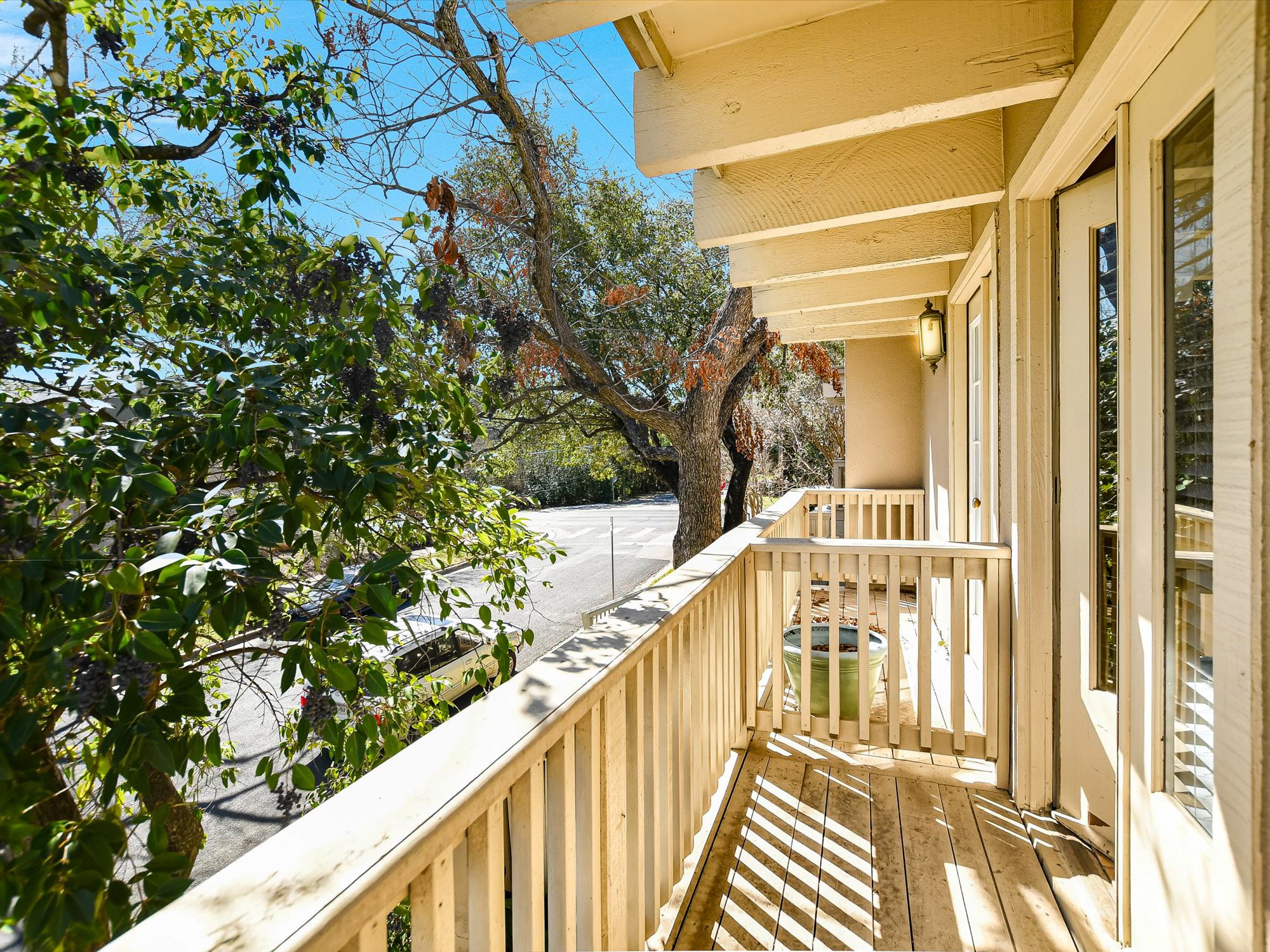 3500 Enfield Road, Unit E Austin, TX 78703 - Photo 16 of 20 a view of balcony with wooden floor and fence