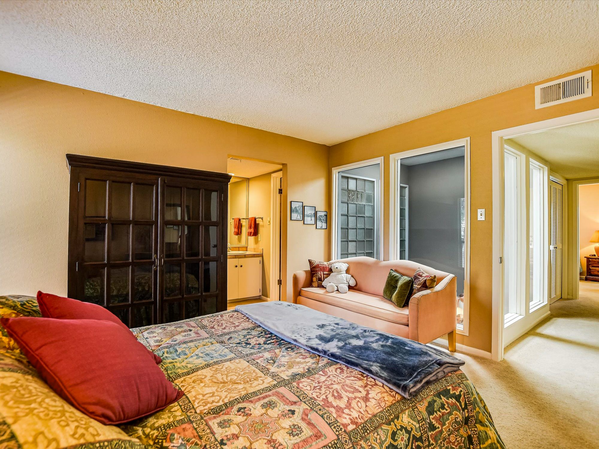 3500 Enfield Road, Unit E Austin, TX 78703 - Photo 20 of 20 a bedroom with a bed and walk in closet