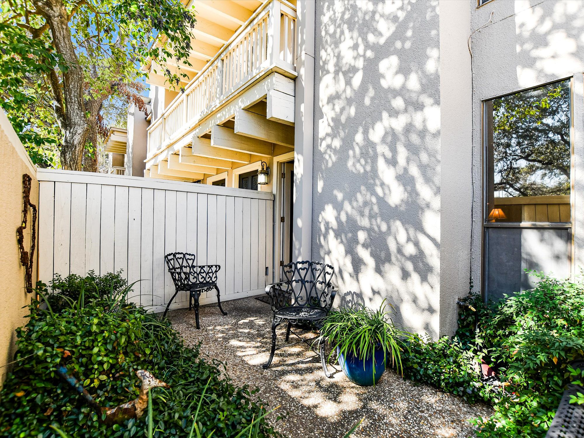 3500 Enfield Road, Unit E Austin, TX 78703 - Photo 3 of 20 a backyard of a house with table and chairs