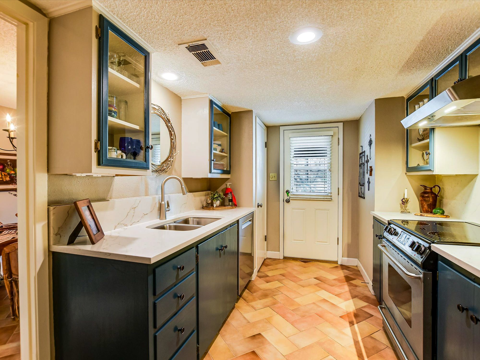 3500 Enfield Road, Unit E Austin, TX 78703 - Photo 6 of 20 a kitchen with a sink stove and refrigerator
