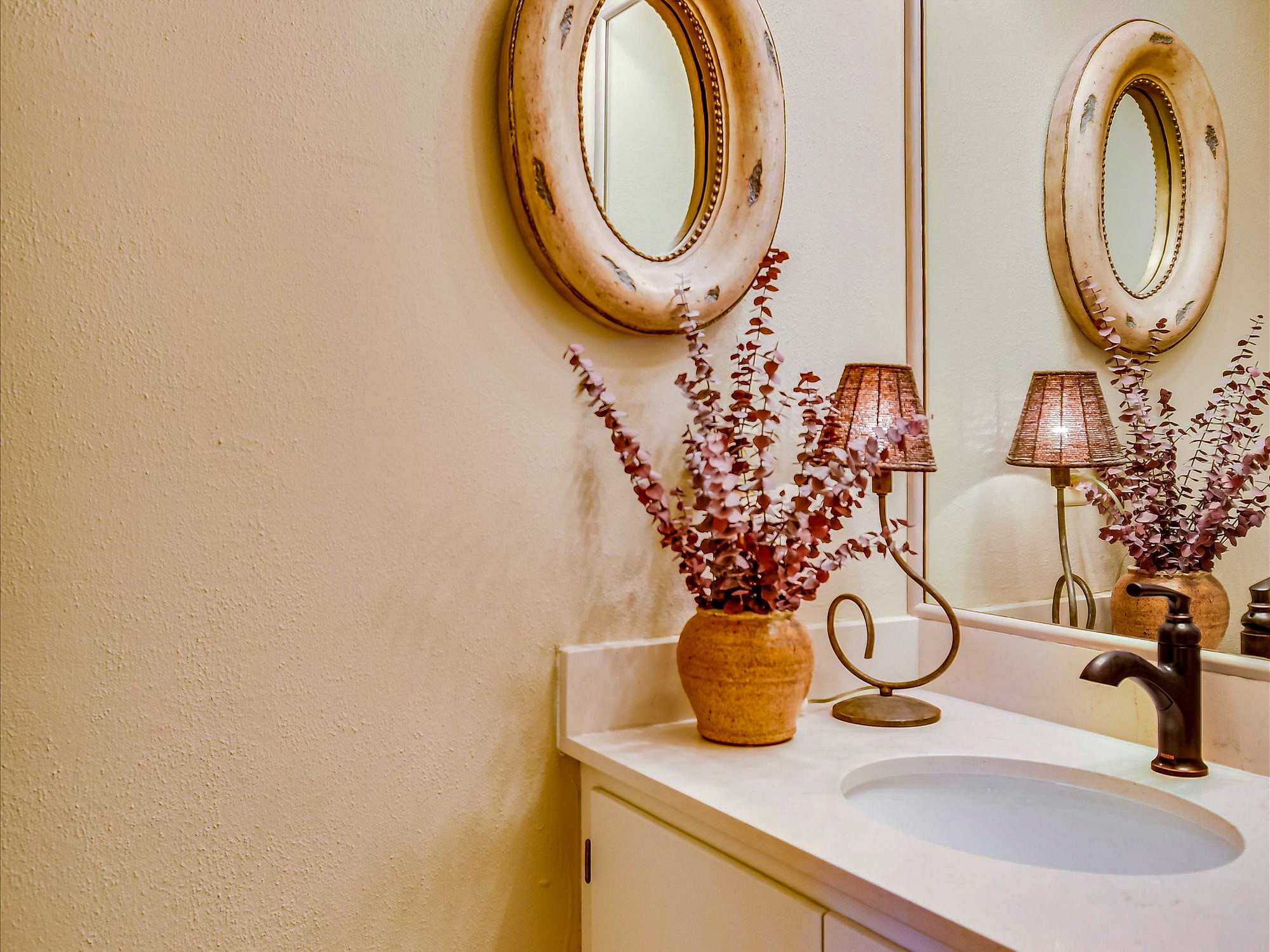 3500 Enfield Road, Unit E Austin, TX 78703 - Photo 10 of 20 a bathroom with a sink and a mirror