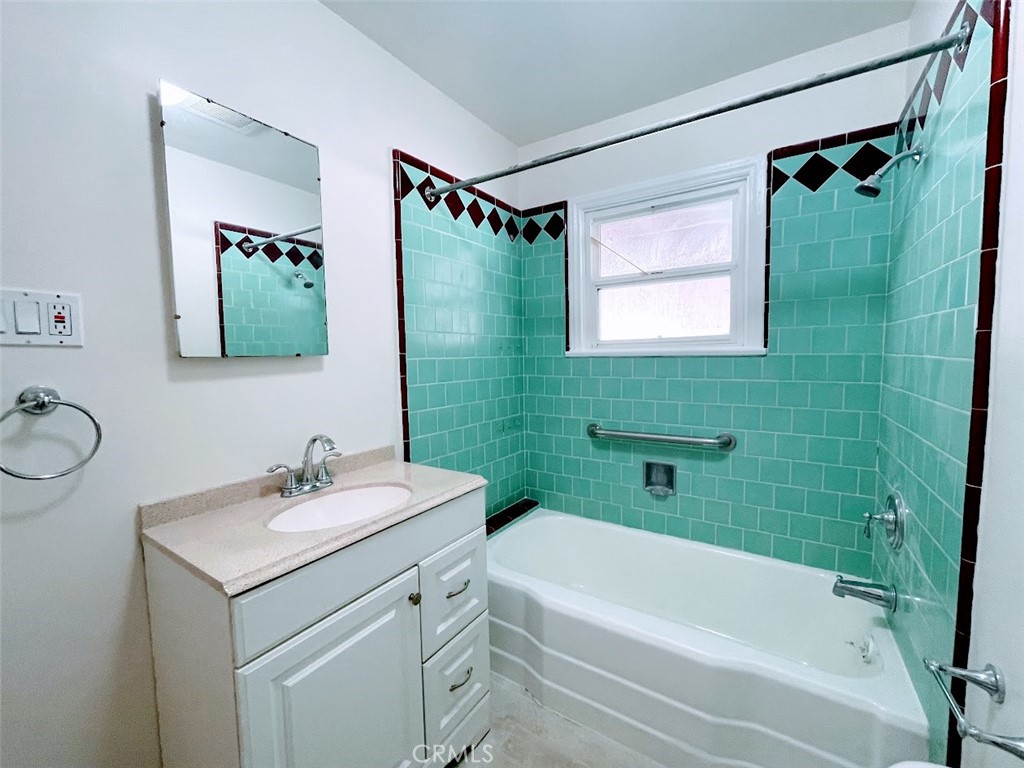 15334 Orizaba Avenue Paramount, CA 90723 - Photo 15 of 16 a bathroom with a sink toilet and shower