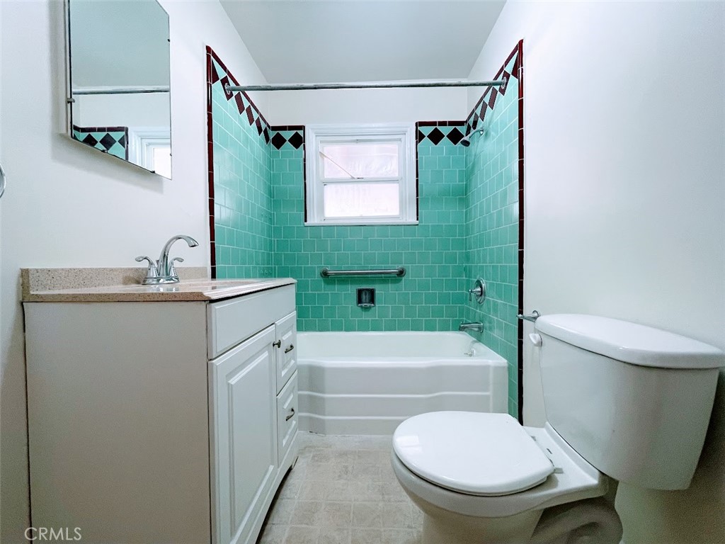 15334 Orizaba Avenue Paramount, CA 90723 - Photo 16 of 16 a bathroom with a sink toilet and a bathtub