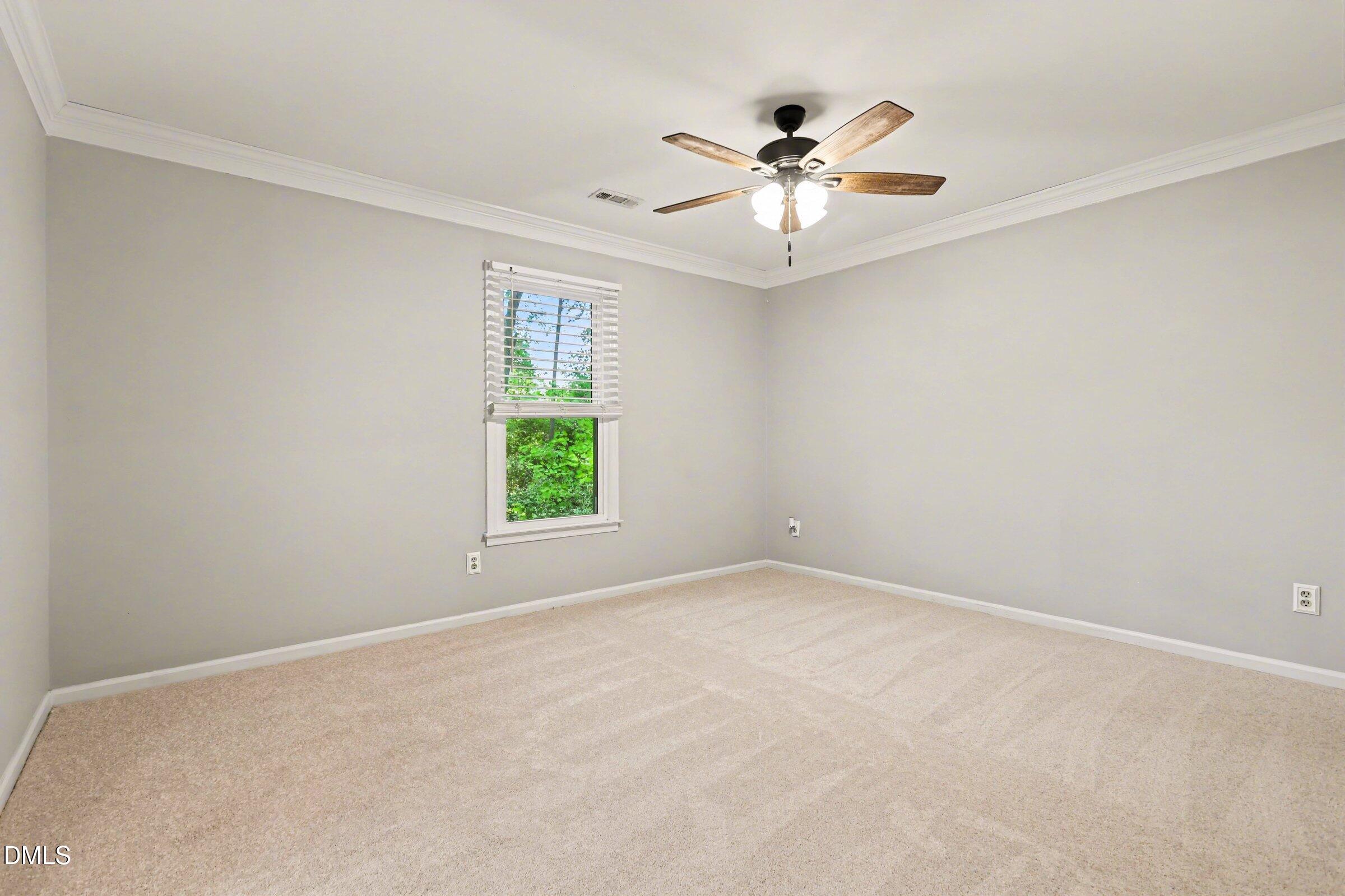 5645 Hamstead Crossing Raleigh, NC 27612 - Photo 15 of 35 an empty room with windows and fan