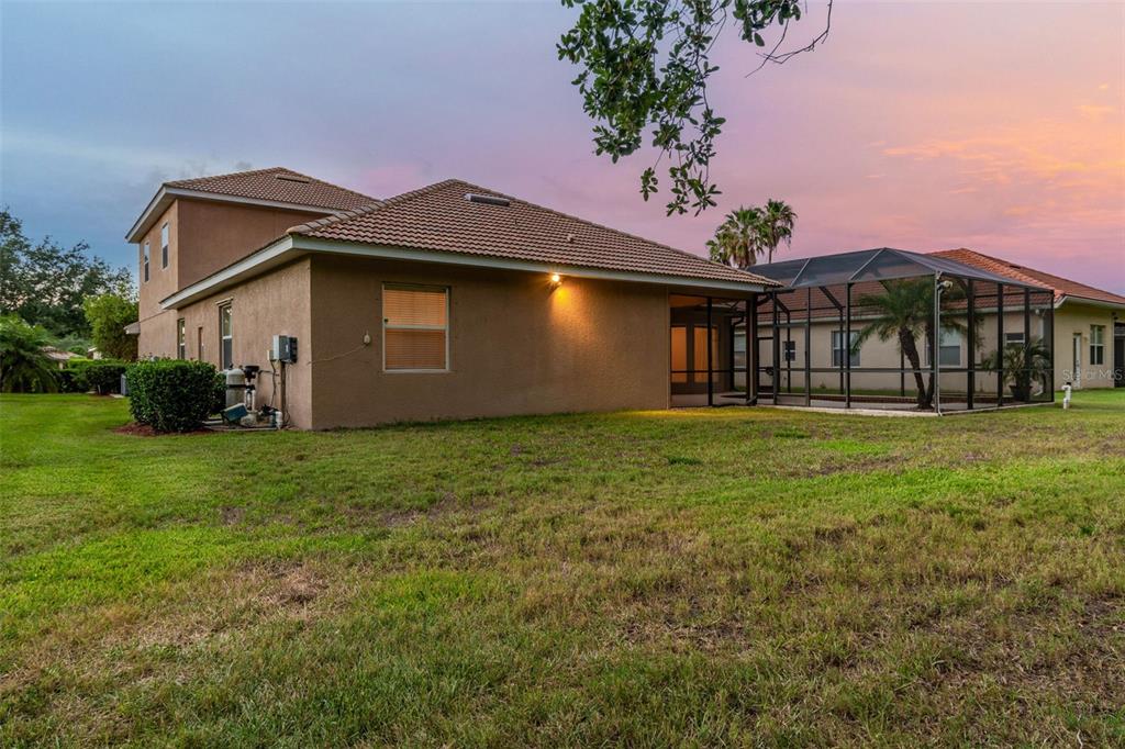 9008 Brookfield Terrace Bradenton, FL 34212 - Photo 13 of 81 a front view of a house with garden