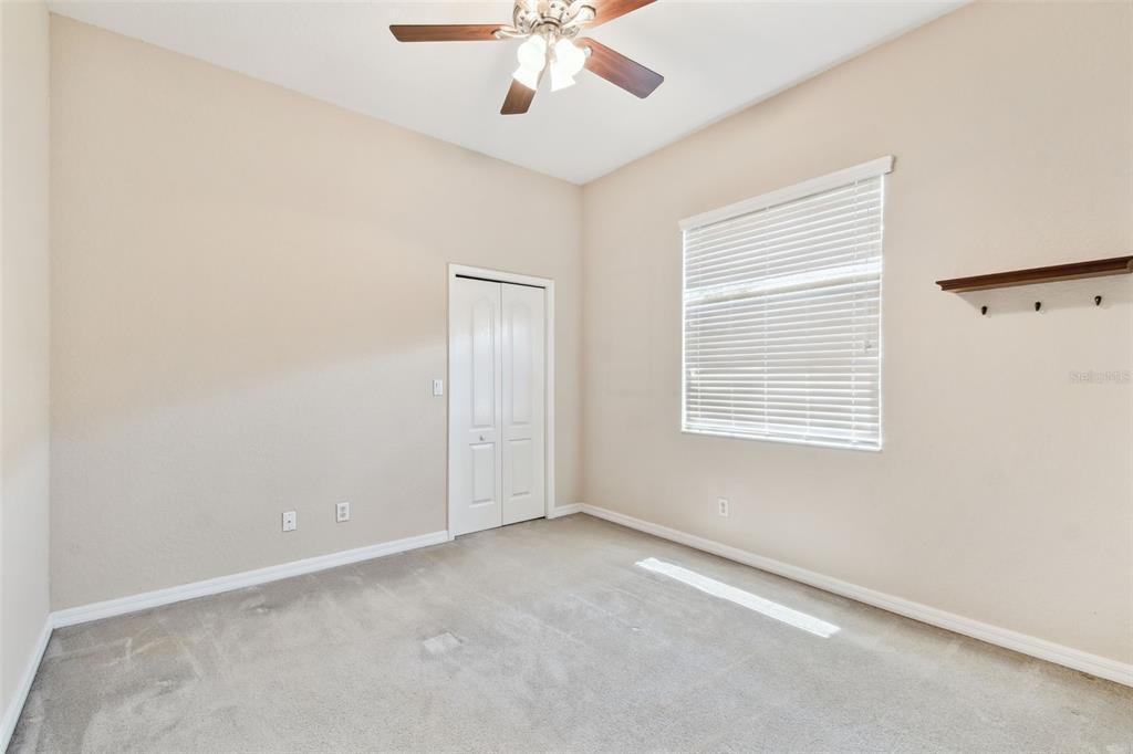 9008 Brookfield Terrace Bradenton, FL 34212 - Photo 15 of 81 an empty room with a window and a ceiling fan