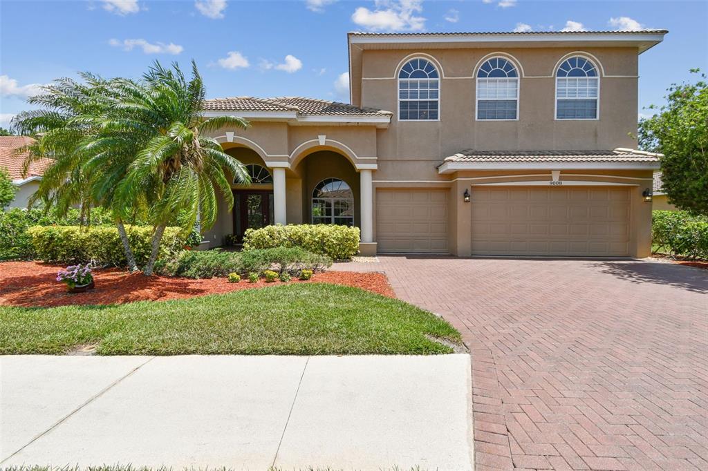 9008 Brookfield Terrace Bradenton, FL 34212 - Photo 2 of 81 a front view of house with yard and green space