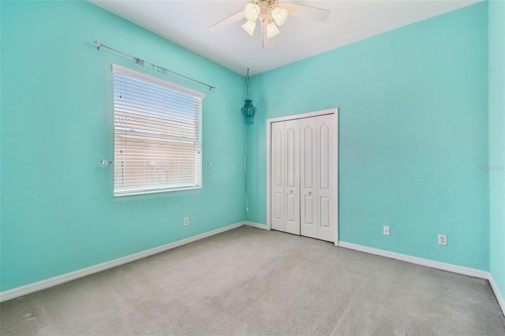 9008 Brookfield Terrace Bradenton, FL 34212 - Photo 38 of 81 an empty room with a window and a ceiling fan
