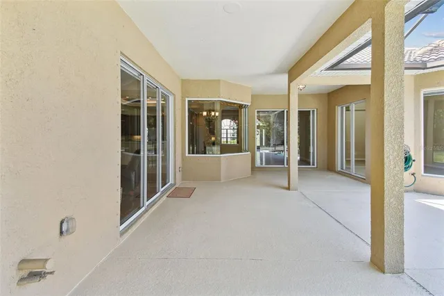 an aerial view of a city with lots of residential buildings ocean and mountain view in back