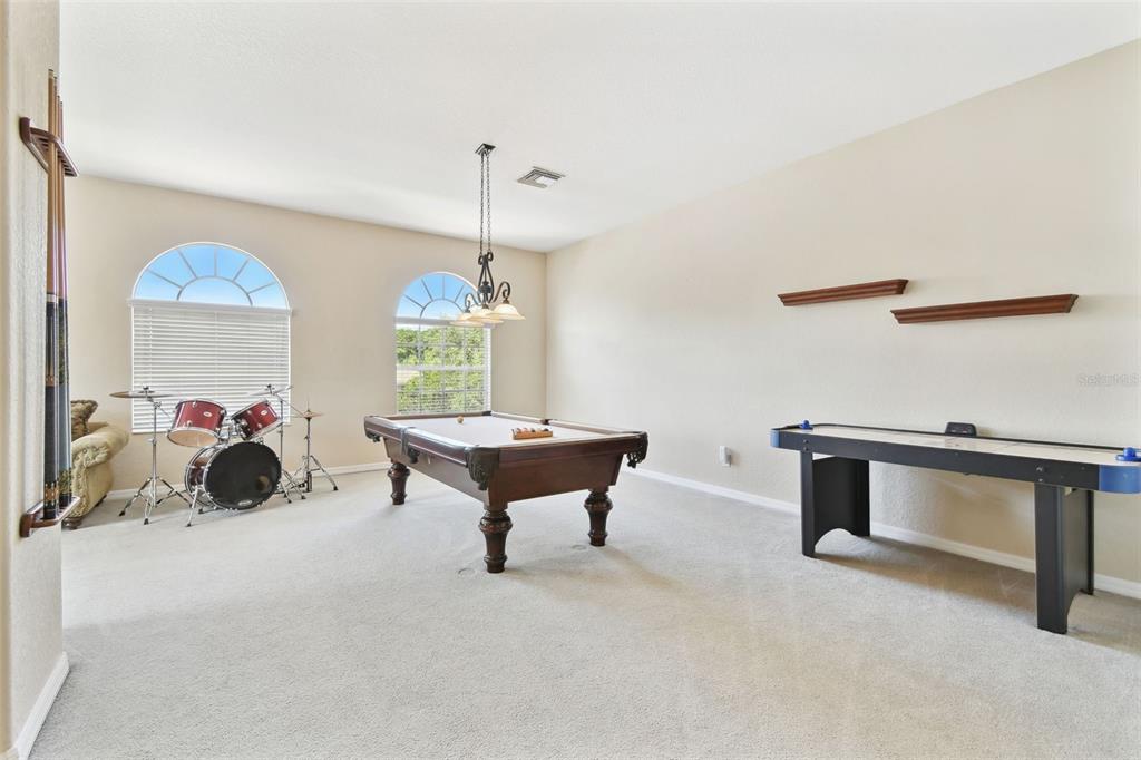 9008 Brookfield Terrace Bradenton, FL 34212 - Photo 42 of 81 a living room with furniture and a window